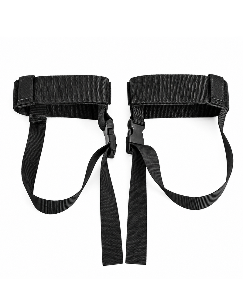 A pair of black nylon foot straps with quick-release plastic buckles, laid flat on a white background.